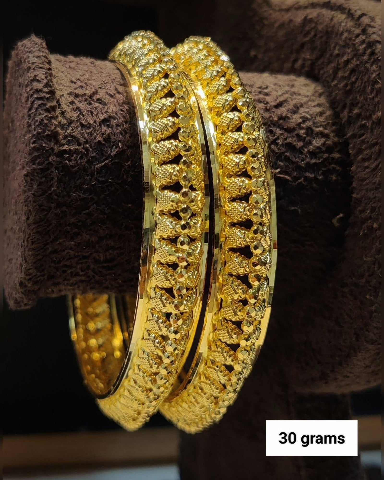 Pair of patterned gold bangles